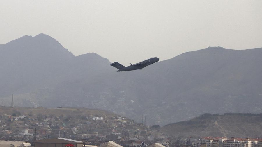 A U.S military aircraft takes off from the Hamid Karzai International Airport in Kabul, Afghanistan, Monday, Aug. 30, 2021. (AP Photo/Wali Sabawoon)