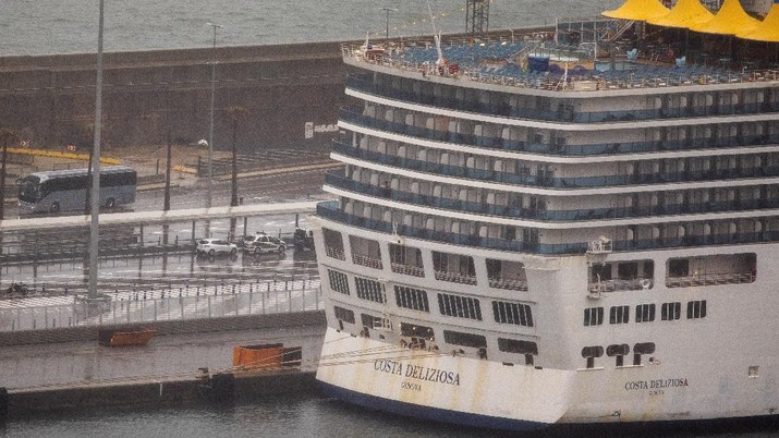 A view of Costa Deliziosa cruise ship moored at the port of Barcelona, Monday, April 20, 2020. Several cruise ships have become coronavirus traps after outbreaks were discovered on board. On Monday the Deliziosa made its first port-of-call in 35 days after docking in Barcelona, Spain. (AP Photo/Emilio Morenatti)