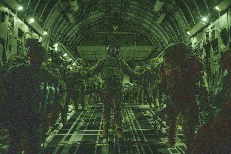 In this Aug. 30, 2021, photo provided by the U.S. Air Force, soldiers, assigned to the 82nd Airborne Division, prepare to board a U.S. Air Force C-17 Globemaster III aircraft at Hamid Karzai International Airport in Kabul, Afghanistan. (Senior Airman Taylor Crul/U.S. Air Force via AP)