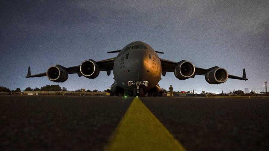 In this Aug. 30, 2021, photo provided by the U.S. Air Force, soldiers, assigned to the 82nd Airborne Division, prepare to board a U.S. Air Force C-17 Globemaster III aircraft at Hamid Karzai International Airport in Kabul, Afghanistan. (Senior Airman Taylor Crul/U.S. Air Force via AP)