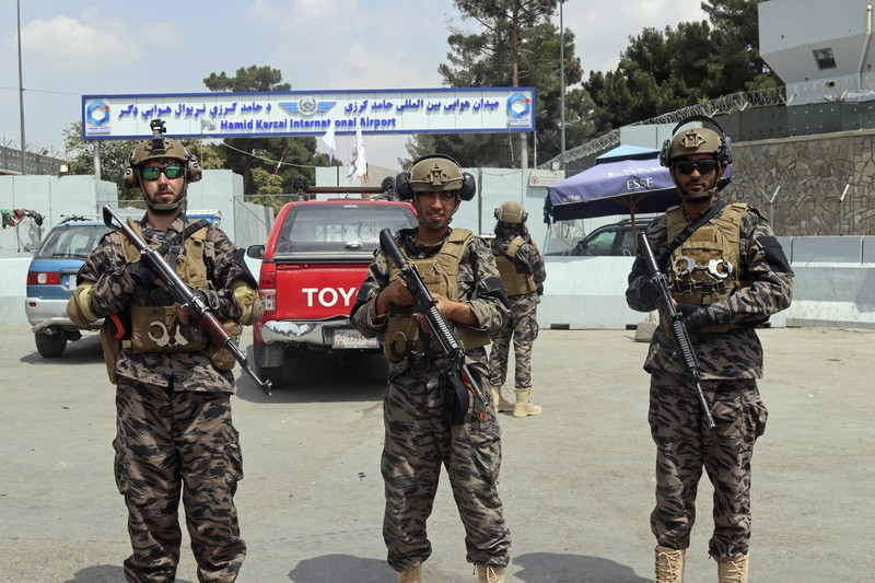 Taliban special forces fighters stand guard outside the Hamid Karzai International Airport after the U.S. military's withdrawal, in Kabul, Afghanistan, Tuesday, Aug. 31, 2021. The Taliban were in full control of Kabul's airport on Tuesday, after the last U.S. plane left its runway, marking the end of America's longest war. (AP Photo/Khwaja Tawfiq Sediqi)