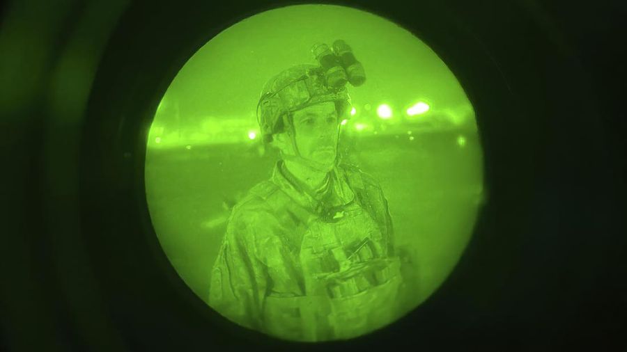 In this Aug. 30, 2021, photo provided by the U.S. Air Force, soldiers, assigned to the 82nd Airborne Division, prepare to board a U.S. Air Force C-17 Globemaster III aircraft at Hamid Karzai International Airport in Kabul, Afghanistan. (Senior Airman Taylor Crul/U.S. Air Force via AP)