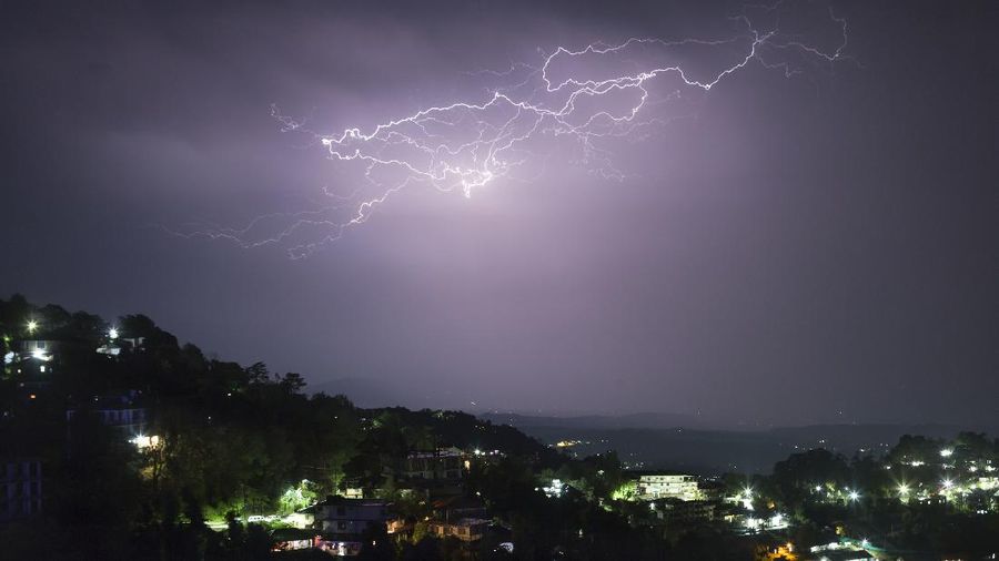 A streak of lightning lights up the sky over Dharmsala, India, Thursday, Sept. 13, 2018. The mountain region is currently receiving monsoon rains. (AP Photo/Ashwini Bhatia)