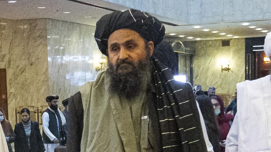 FILE - In this March 18, 2021, file photo, Taliban co-founder Mullah Abdul Ghani Baradar, arrives with other members of the Taliban delegation for an international peace conference in Moscow, Russia. Baradar's biography charts the Taliban's long journey from a pious but brutal Islamic militia to an insurgency that battled the U.S. for two decades, ultimately returning to power through pragmatic diplomacy and military might. His experience also sheds light on the Taliban's complicated relationship with neighboring Pakistan. (AP Photo/Alexander Zemlianichenko, Pool, File)