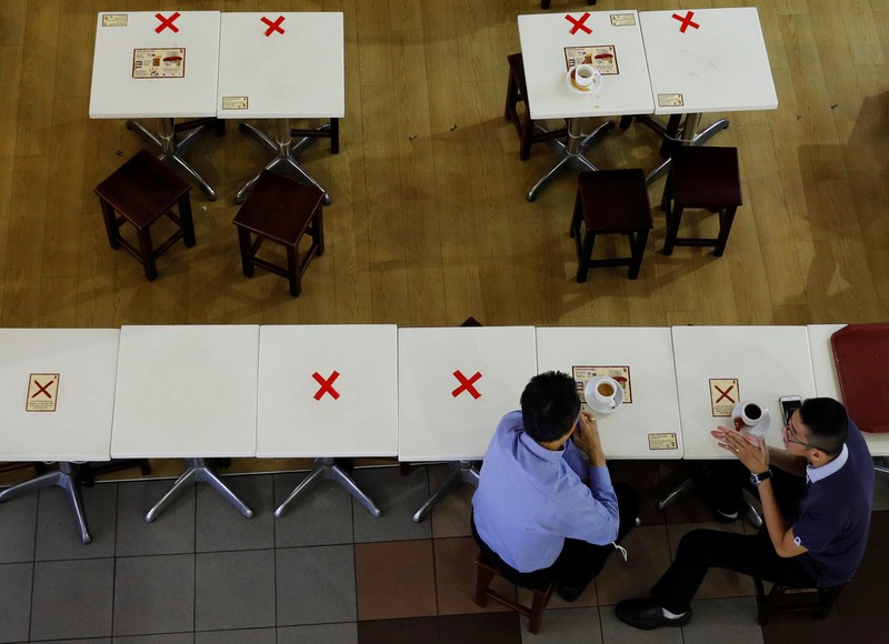 Lonjakan kasus Covid-19 di Singapura. (REUTERS/EDGAR SU)