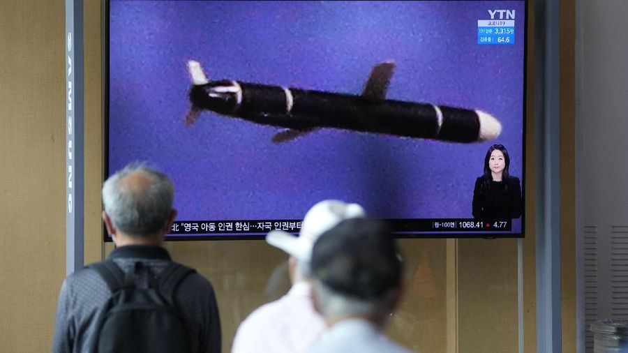 People watch a TV screen showing a news program reporting about North Korea's long-range cruise missiles tests with images in Seoul, South Korea, Monday, Sept. 13, 2021. North Korea says it successfully test fired newly developed long-range cruise missiles over the weekend, its first known testing activity in months, underscoring how it continues to expand its military capabilities amid a stalemate in nuclear negotiations with the United States. The letters read,