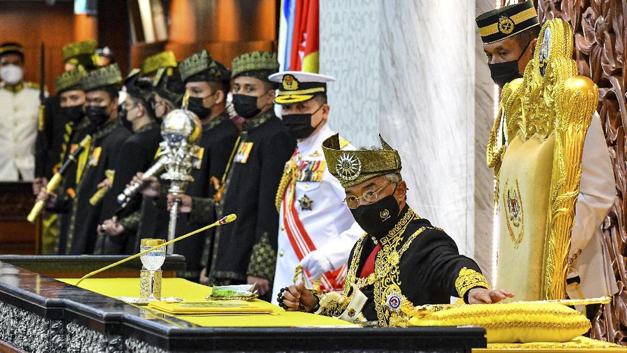 In this photo released by Malaysia's Department of Information, Malaysia's King Sultan Abdullah Sultan Ahmad Shah attends the opening ceremony of the parliamentary session at the parliament house in Kuala Lumpur, Malaysia, Monday, Sept. 13, 2021. (Zarith Zulkifli/Malaysia's Department of Information via AP)