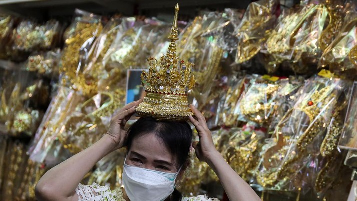 A costumer looks for Thai traditional costume head gear similar to one wore by Thai-born K-pop singer Lalisa 