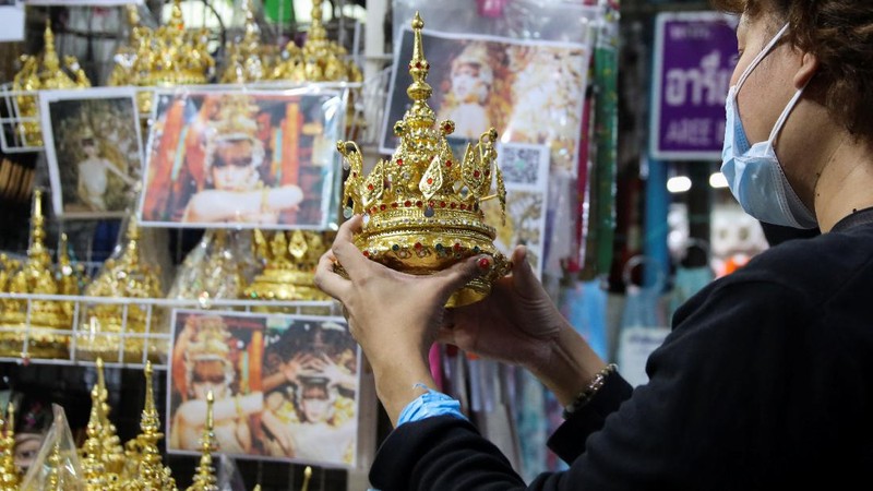A costumer looks for Thai traditional costume head gear similar to one wore by Thai-born K-pop singer Lalisa 