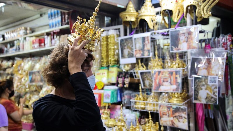 A costumer looks for Thai traditional costume head gear similar to one wore by Thai-born K-pop singer Lalisa 