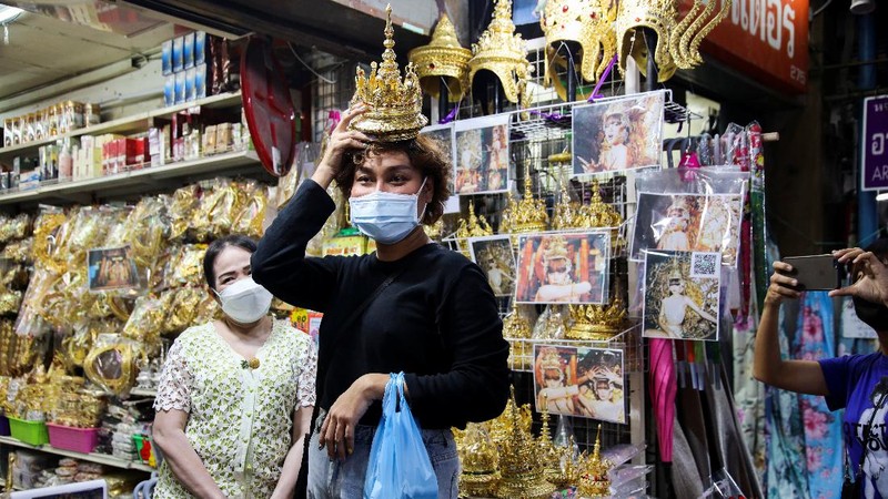 A costumer looks for Thai traditional costume head gear similar to one wore by Thai-born K-pop singer Lalisa 
