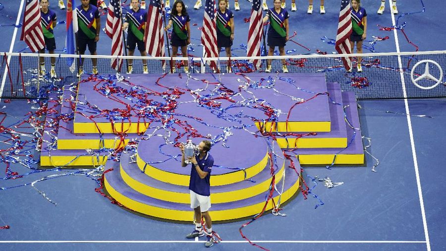 Daniil Medvedev, of Russia, kisses the championship trophy after defeating Novak Djokovic, of Serbia, during the men's singles final of the US Open tennis championships, Sunday, Sept. 12, 2021, in New York. (AP Photo/Seth Wenig)
