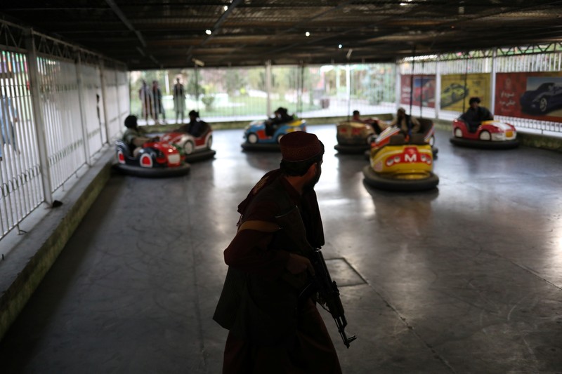 Taliban soldiers ride bumper cars in an amusement park in Kabul, Afghanistan, September 13, 2021. WANA (West Asia News Agency) via REUTERS ATTENTION EDITORS - THIS IMAGE HAS BEEN SUPPLIED BY A THIRD PARTY.