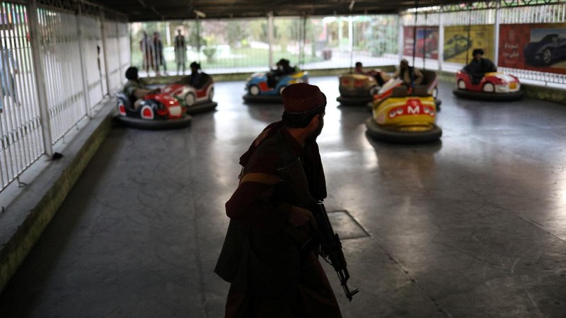 Taliban soldiers ride bumper cars in an amusement park in Kabul, Afghanistan, September 13, 2021. WANA (West Asia News Agency) via REUTERS ATTENTION EDITORS - THIS IMAGE HAS BEEN SUPPLIED BY A THIRD PARTY.