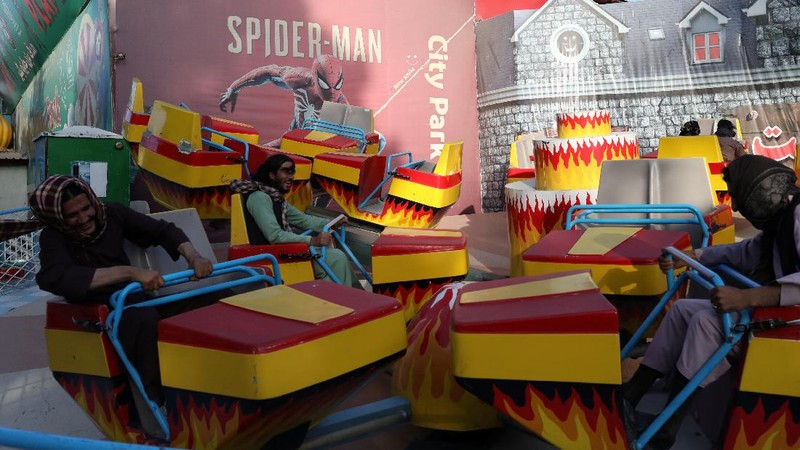 Taliban soldiers ride bumper cars in an amusement park in Kabul, Afghanistan, September 13, 2021. WANA (West Asia News Agency) via REUTERS ATTENTION EDITORS - THIS IMAGE HAS BEEN SUPPLIED BY A THIRD PARTY.
