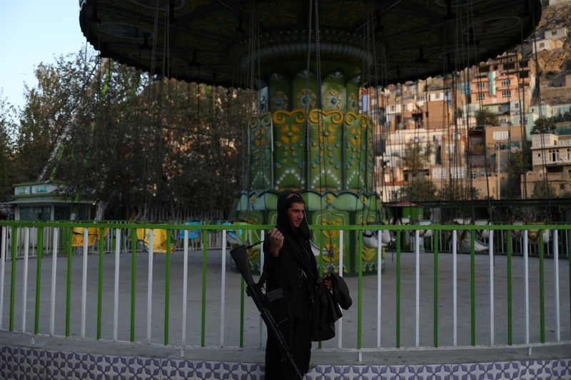 AFGHANISTAN-CONFLICT/ Taliban soldiers ride bumper cars in an amusement park in Kabul, Afghanistan, September 13, 2021. WANA (West Asia News Agency) via REUTERS ATTENTION EDITORS - THIS IMAGE HAS BEEN SUPPLIED BY A THIRD PARTY.