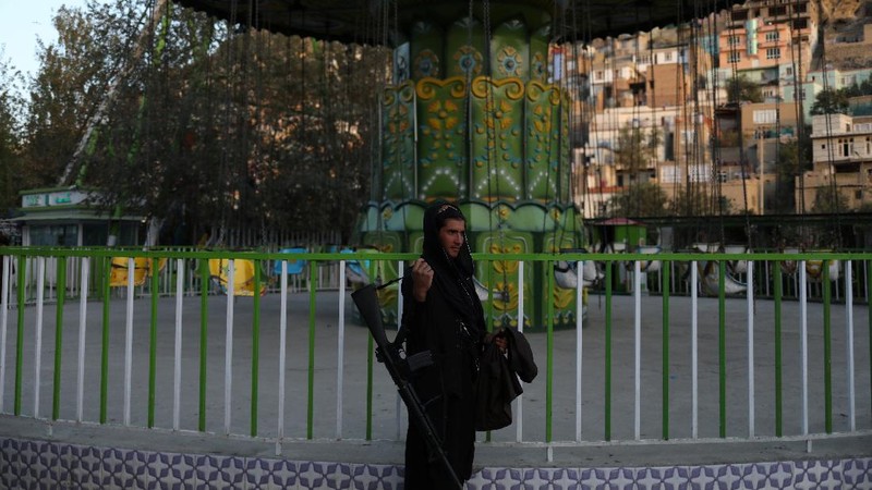 Taliban soldiers ride bumper cars in an amusement park in Kabul, Afghanistan, September 13, 2021. WANA (West Asia News Agency) via REUTERS ATTENTION EDITORS - THIS IMAGE HAS BEEN SUPPLIED BY A THIRD PARTY.
