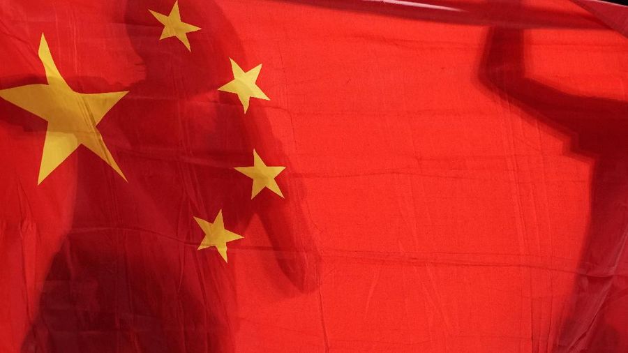China's Chen Meng, left, and Sun Yingsha hold their national flag after winning the table tennis women's singles gold medal match at the 2020 Summer Olympics, Thursday, July 29, 2021, in Tokyo. (AP Photo/Kin Cheung)