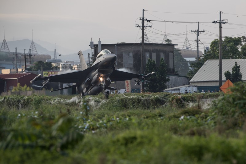 In this photo released by the Taiwan Presidential Office, a military jet taxis along a highway in Jiadong, Taiwan, Wednesday, Sept. 15, 2021. Four military aircraft landed on the highway and took off again on Wednesday as part of Taiwan's five-day Han Guang military exercise designed to prepare the island's forces for an attack by China, which claims Taiwan as part of its own territory. (Taiwan Presidential Office via AP)