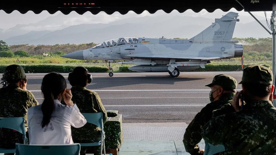 In this photo released by the Taiwan Presidential Office, a military jet taxis along a highway in Jiadong, Taiwan, Wednesday, Sept. 15, 2021. Four military aircraft landed on the highway and took off again on Wednesday as part of Taiwan's five-day Han Guang military exercise designed to prepare the island's forces for an attack by China, which claims Taiwan as part of its own territory. (Taiwan Presidential Office via AP)