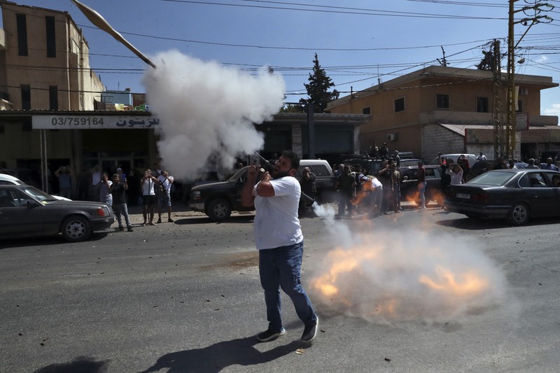 A convoy of tanker trucks carrying Iranian diesel crossing the border from Syria into Lebanon, arrive at the eastern town of el-Ain, Lebanon, Thursday, Sept. 16, 2021. The delivery, organized by the Iranian-backed Hezbollah group, violates U.S. sanctions imposed on Tehran after former President Donald Trump pulled America out of a nuclear deal between Iran and world powers three years ago. (AP Photo/Bilal Hussein)