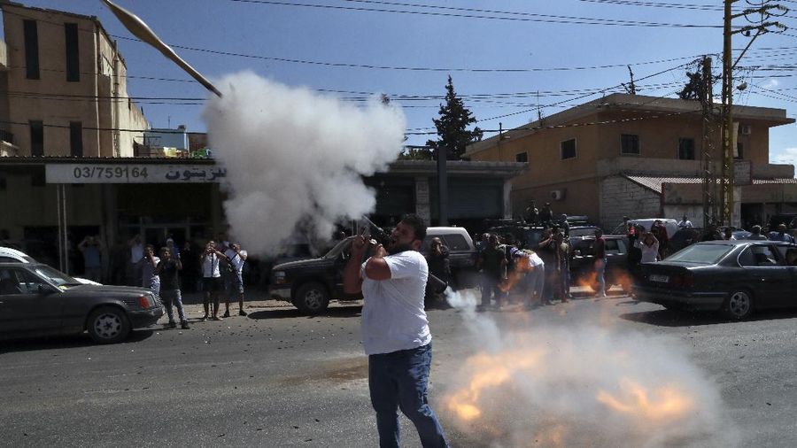 A convoy of tanker trucks carrying Iranian diesel crossing the border from Syria into Lebanon, arrive at the eastern town of el-Ain, Lebanon, Thursday, Sept. 16, 2021. The delivery, organized by the Iranian-backed Hezbollah group, violates U.S. sanctions imposed on Tehran after former President Donald Trump pulled America out of a nuclear deal between Iran and world powers three years ago. (AP Photo/Bilal Hussein)