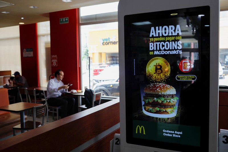 People take part in a protest against the use of Bitcoin as legal tender and legal reforms to extend president Nayib Bukele's term in San Salvador, El Salvador, September 15, 2021. REUTERS/Jose Cabezas
