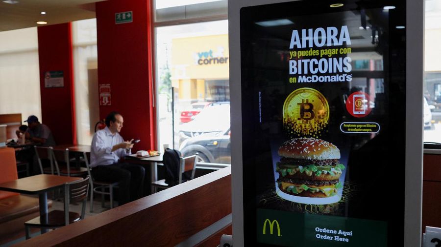 People take part in a protest against the use of Bitcoin as legal tender and legal reforms to extend president Nayib Bukele's term in San Salvador, El Salvador, September 15, 2021. REUTERS/Jose Cabezas