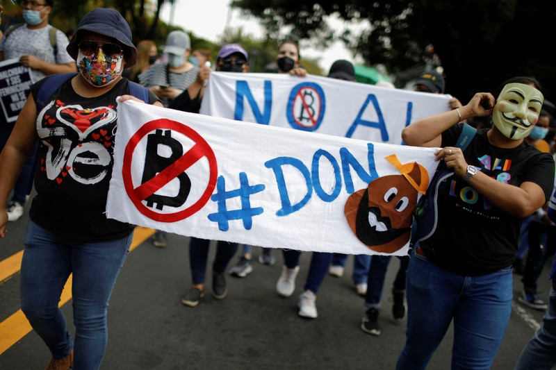 People take part in a protest against the use of Bitcoin as legal tender and legal reforms to extend president Nayib Bukele's term in San Salvador, El Salvador, September 15, 2021. REUTERS/Jose Cabezas