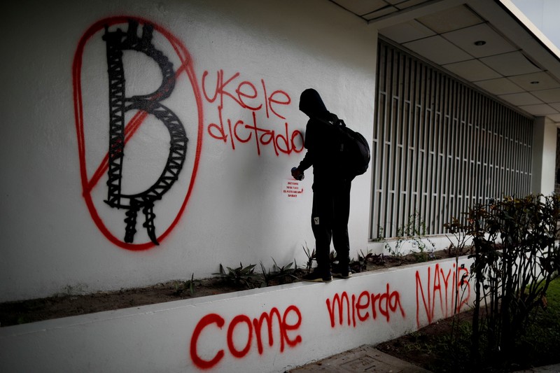 People take part in a protest against the use of Bitcoin as legal tender and legal reforms to extend president Nayib Bukele's term in San Salvador, El Salvador, September 15, 2021. REUTERS/Jose Cabezas