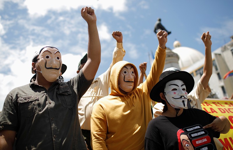 People take part in a protest against the use of Bitcoin as legal tender and legal reforms to extend president Nayib Bukele's term in San Salvador, El Salvador, September 15, 2021. REUTERS/Jose Cabezas