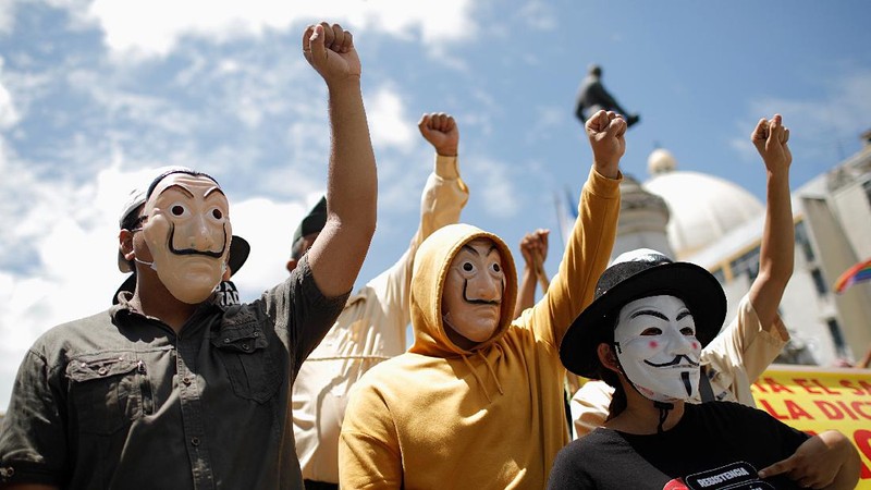 People take part in a protest against the use of Bitcoin as legal tender and legal reforms to extend president Nayib Bukele's term in San Salvador, El Salvador, September 15, 2021. REUTERS/Jose Cabezas