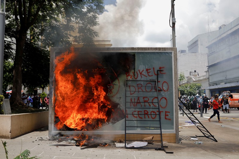 People take part in a protest against the use of Bitcoin as legal tender and legal reforms to extend president Nayib Bukele's term in San Salvador, El Salvador, September 15, 2021. REUTERS/Jose Cabezas
