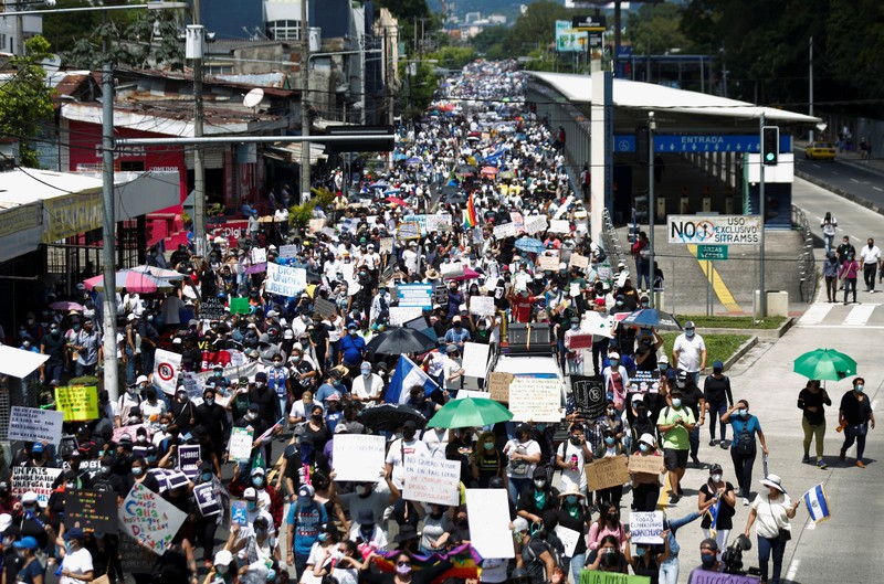 People take part in a protest against the use of Bitcoin as legal tender and legal reforms to extend president Nayib Bukele's term in San Salvador, El Salvador, September 15, 2021. REUTERS/Jose Cabezas