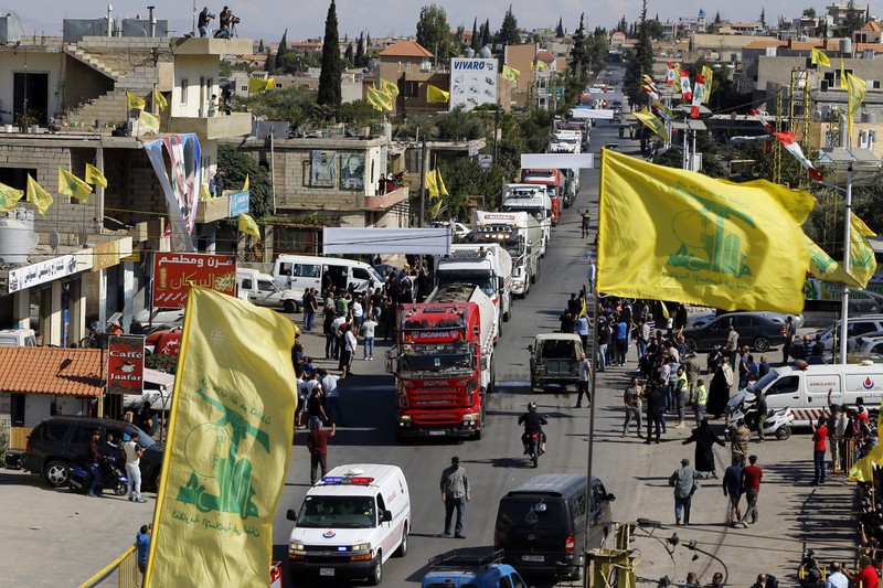 A convoy of tanker trucks carrying Iranian diesel crossing the border from Syria into Lebanon, arrive at the eastern town of el-Ain, Lebanon, Thursday, Sept. 16, 2021. The delivery, organized by the Iranian-backed Hezbollah group, violates U.S. sanctions imposed on Tehran after former President Donald Trump pulled America out of a nuclear deal between Iran and world powers three years ago. (AP Photo/Bilal Hussein)