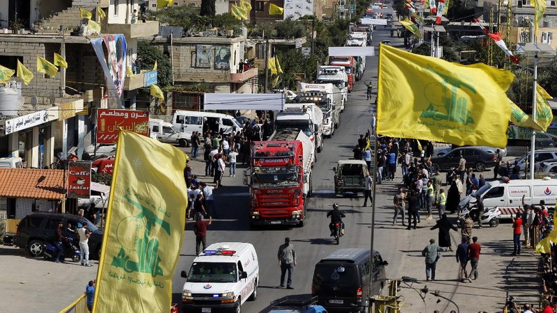 A convoy of tanker trucks carrying Iranian diesel crossing the border from Syria into Lebanon, arrive at the eastern town of el-Ain, Lebanon, Thursday, Sept. 16, 2021. The delivery, organized by the Iranian-backed Hezbollah group, violates U.S. sanctions imposed on Tehran after former President Donald Trump pulled America out of a nuclear deal between Iran and world powers three years ago. (AP Photo/Bilal Hussein)