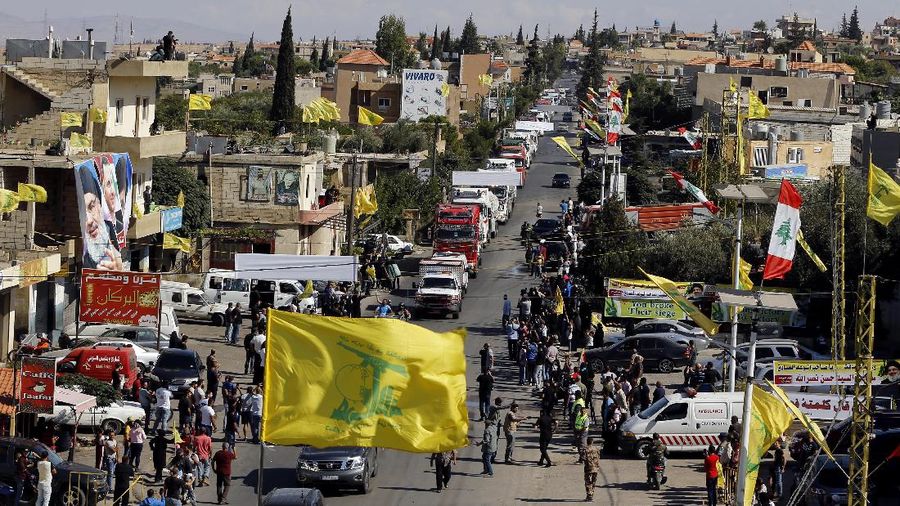 A convoy of tanker trucks carrying Iranian diesel crossed the border from Syria into Lebanon, arrives at the eastern town of el-Ain, Lebanon, Thursday, Sept. 16, 2021. The delivery, organized by the Iranian-backed Hezbollah group, violates U.S. sanctions imposed on Tehran after former President Donald Trump pulled America out of a nuclear deal between Iran and world powers three years ago. (AP Photo/Bilal Hussein)