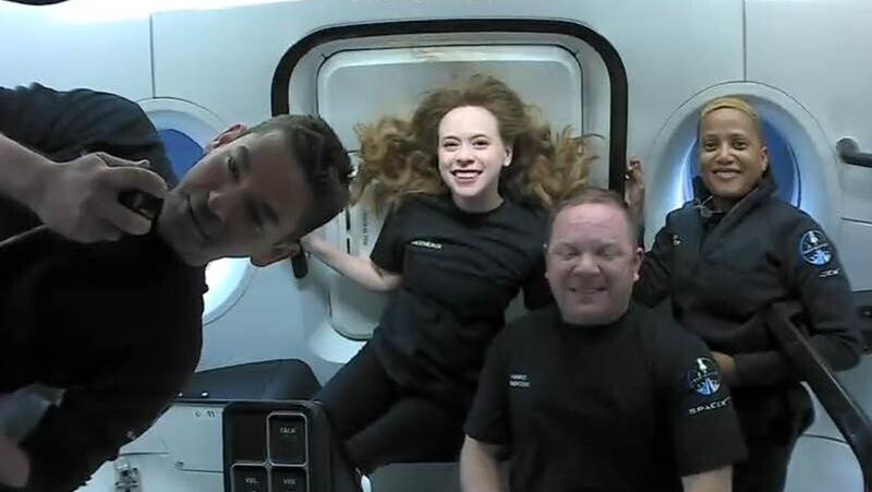 This photo provided by SpaceX shows the passengers of Inspiration4 in the Dragon capsule on their first day in space. They are, from left, Jared Isaacman, Hayley Arceneaux, Chris Sembroski and Sian Proctor.   SpaceX got them into a 363-mile (585-kilometer) orbit following Wednesday night’s launch from NASA's Kennedy Space Center. That's 100 miles (160 kilometers) higher than the International Space Station.  (SpaceX via AP)
