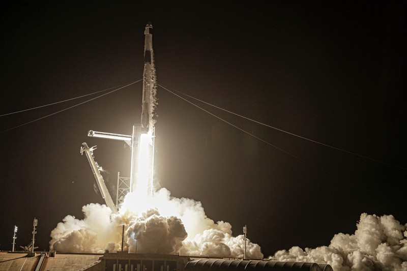 In this image taken from SpaceX video, passengers aboard a SpaceX capsule react as the capsule parachutes into the Atlantic Ocean off the Florida coast, Saturday, Sept. 18, 2021. The all-amateur crew was the first to circle the world without a professional astronaut.  (SpaceX via AP)
