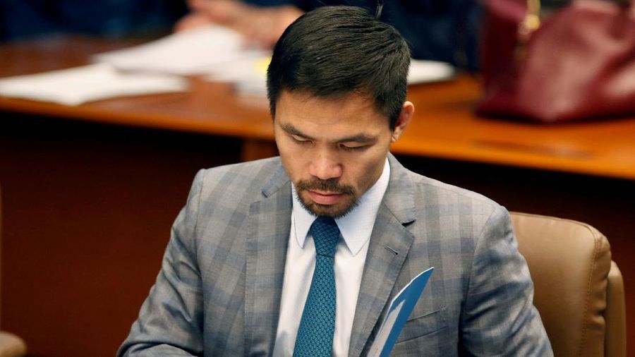 FILE - Manny Pacquiao reacts after defeating Keith Thurman by split decision in a welterweight title fight in Las Vegas, in this Saturday, July 20, 2019, file photo. Pacquiao could have canceled his comeback from a two-year ring layoff when Errol Spence Jr. dropped out less than two weeks before their Aug. 21 fight. Instead, the Filipino congressman gave a career-defining opportunity to Yordenis Ugás, a Cuban veteran who now has the welterweight title belt Pacquiao recently held. (AP Photo/John Locher, File)
