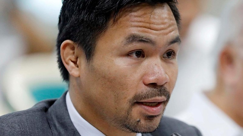 FILE - Manny Pacquiao reacts after defeating Keith Thurman by split decision in a welterweight title fight in Las Vegas, in this Saturday, July 20, 2019, file photo. Pacquiao could have canceled his comeback from a two-year ring layoff when Errol Spence Jr. dropped out less than two weeks before their Aug. 21 fight. Instead, the Filipino congressman gave a career-defining opportunity to Yordenis Ugás, a Cuban veteran who now has the welterweight title belt Pacquiao recently held. (AP Photo/John Locher, File)