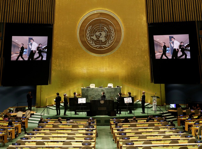 Members of the South Korean band BTS walk near the United Nations headquarters during the 76th Session of the United Nations General Assembly in Manhattan, New York, U.S., September 20, 2021. REUTERS/Eduardo Munoz
