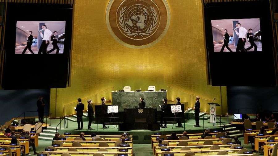 Members of the South Korean band BTS walk near the United Nations headquarters during the 76th Session of the United Nations General Assembly in Manhattan, New York, U.S., September 20, 2021. REUTERS/Eduardo Munoz