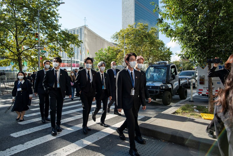 Members of the South Korean band BTS walk near the United Nations headquarters during the 76th Session of the United Nations General Assembly in Manhattan, New York, U.S., September 20, 2021. REUTERS/Eduardo Munoz
