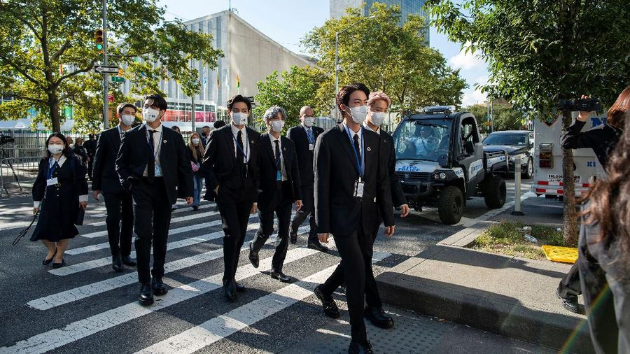 Members of the South Korean band BTS walk near the United Nations headquarters during the 76th Session of the United Nations General Assembly in Manhattan, New York, U.S., September 20, 2021. REUTERS/Eduardo Munoz