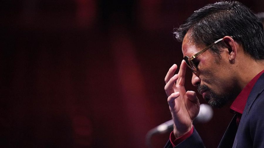FILE - Manny Pacquiao reacts after defeating Keith Thurman by split decision in a welterweight title fight in Las Vegas, in this Saturday, July 20, 2019, file photo. Pacquiao could have canceled his comeback from a two-year ring layoff when Errol Spence Jr. dropped out less than two weeks before their Aug. 21 fight. Instead, the Filipino congressman gave a career-defining opportunity to Yordenis Ugás, a Cuban veteran who now has the welterweight title belt Pacquiao recently held. (AP Photo/John Locher, File)