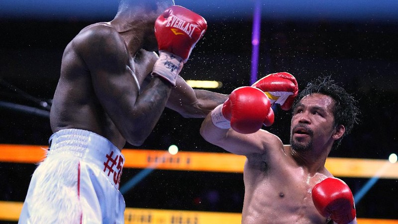 FILE - Manny Pacquiao reacts after defeating Keith Thurman by split decision in a welterweight title fight in Las Vegas, in this Saturday, July 20, 2019, file photo. Pacquiao could have canceled his comeback from a two-year ring layoff when Errol Spence Jr. dropped out less than two weeks before their Aug. 21 fight. Instead, the Filipino congressman gave a career-defining opportunity to Yordenis Ugás, a Cuban veteran who now has the welterweight title belt Pacquiao recently held. (AP Photo/John Locher, File)