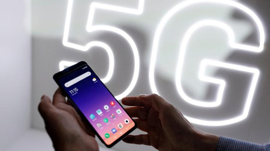 FILE PHOTO: FILE PHOTO: A person checks out the new Xiaomi Mi 9 mobile phone ahead of the Mobile World Congress (MWC 19) in Barcelona, Spain, February 24, 2019. REUTERS/Rafael Marchante/File Photo/File Photo