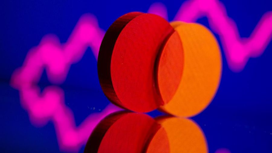 A 3D printed Mastercard logo is seen in front of displayed stock graph in this illustration taken September 20, 2021. REUTERS/Dado Ruvic/Illustration