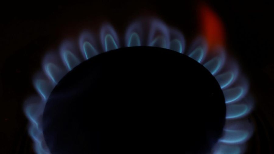 Flames come out of a domestic gas ring on a stove in Manchester, Britain, September 20, 2021. REUTERS/Phil Noble